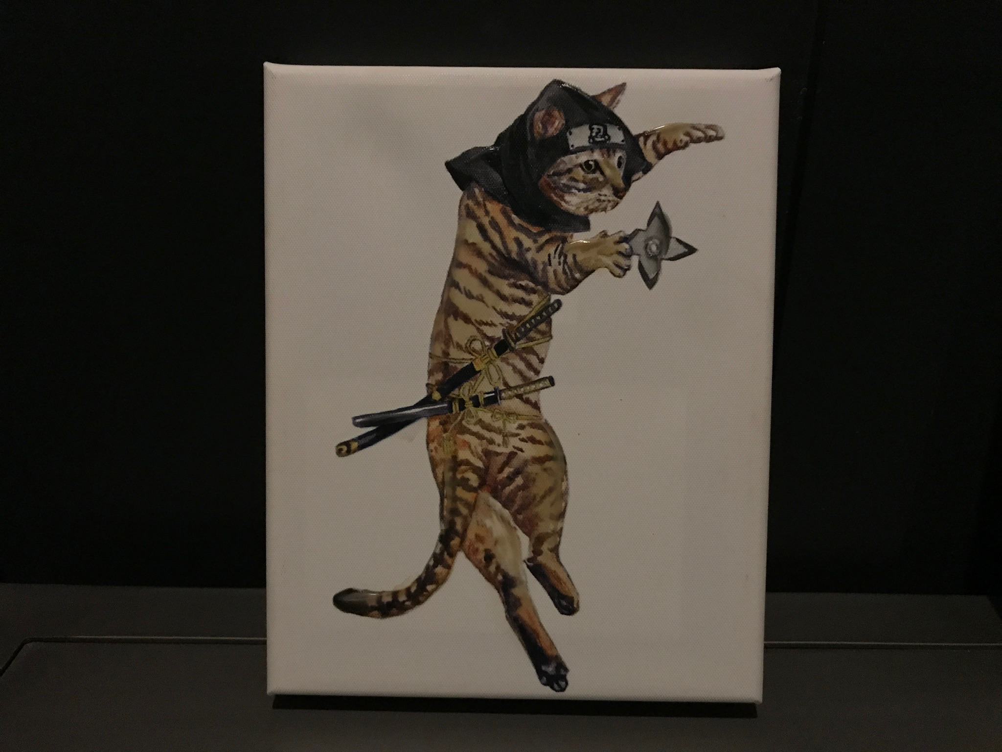 A painting of a cat dressed as a ninja, holding a shuriken and a katana, against a plain white background.