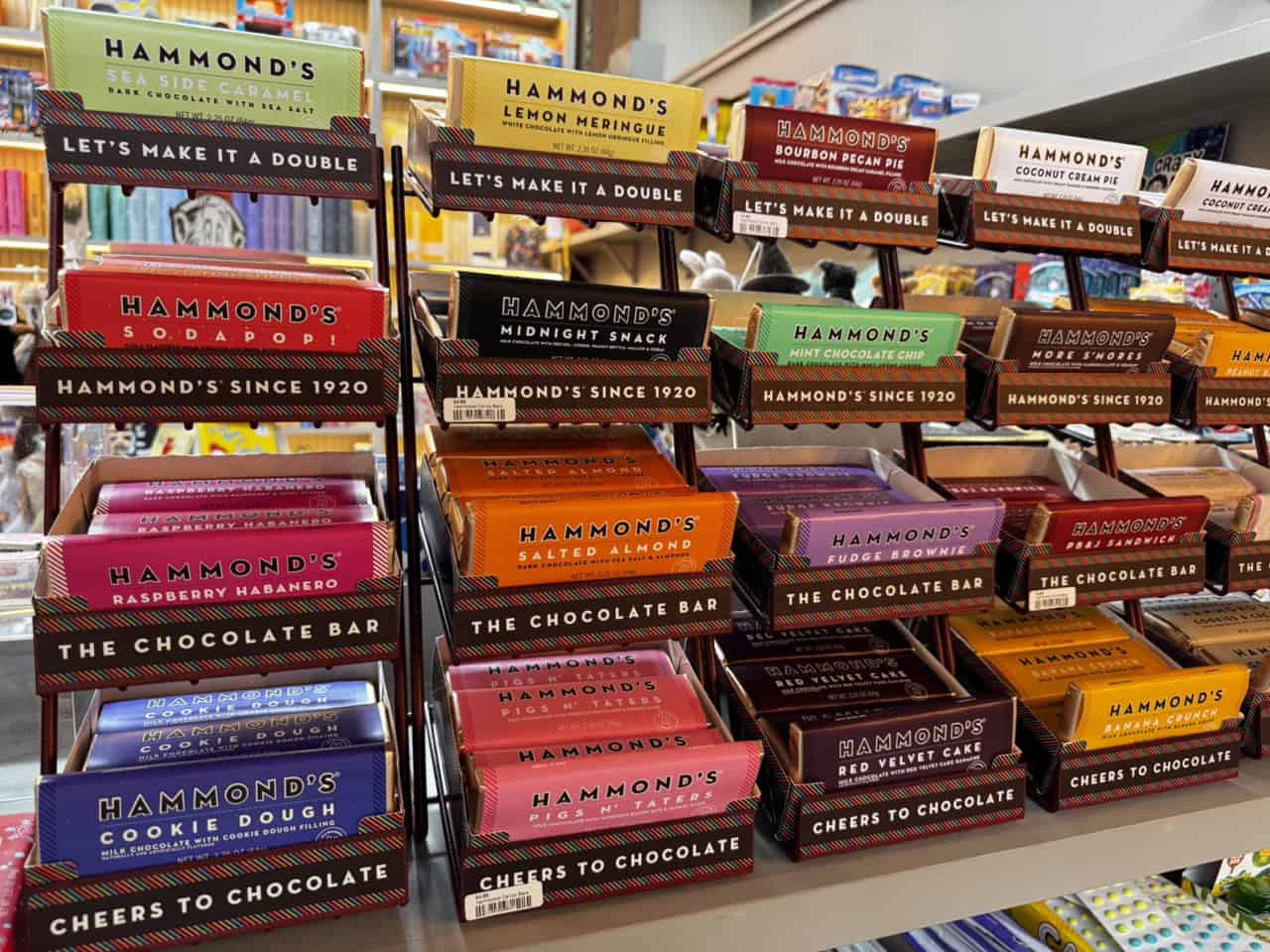 A delightful display of Hammond's chocolate bars in unique flavors like raspberry habanero, sea salt caramel, and birthday cake, perfectly arranged on Nashville store shelves.
