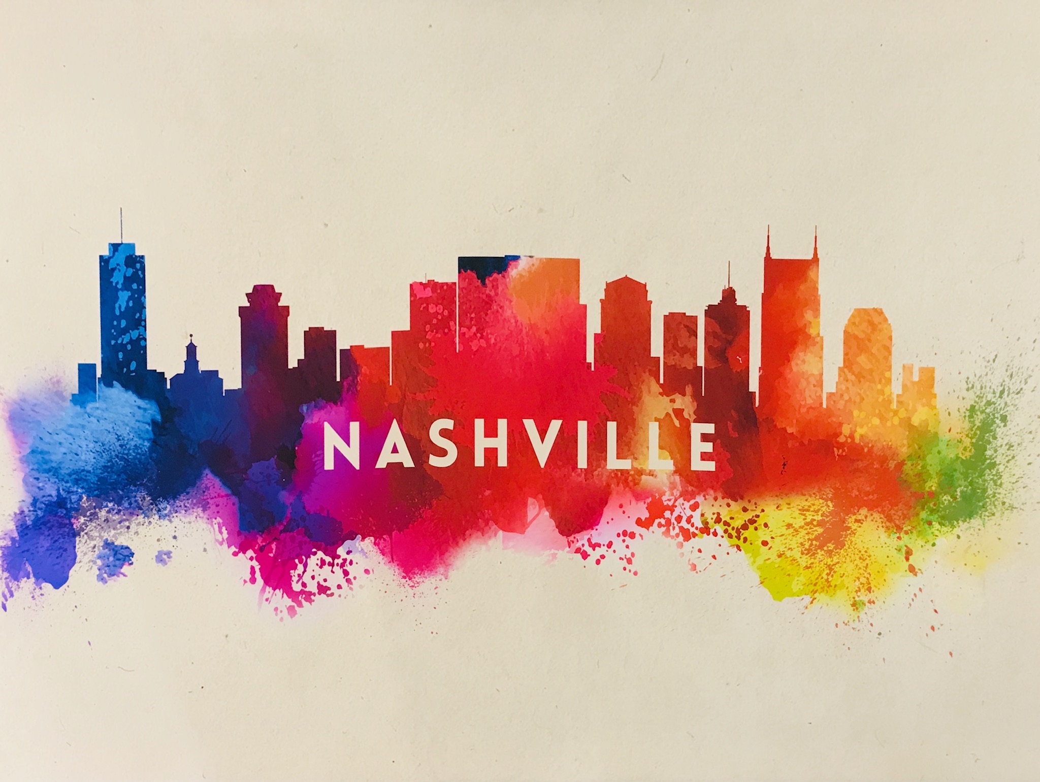 A colorful artistic illustration of the Nashville skyline with the word "Nashville" in white capital letters across the center.