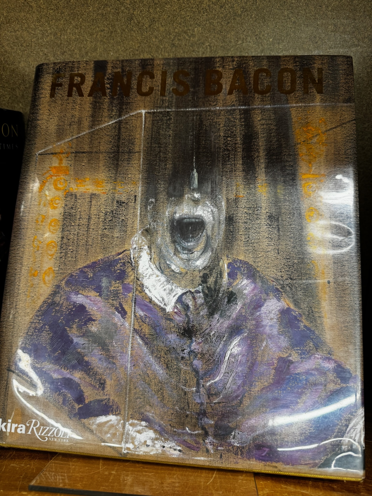 A book cover featuring a distorted, screaming figure painting with "FRANCIS BACON" in large gold letters at the top.